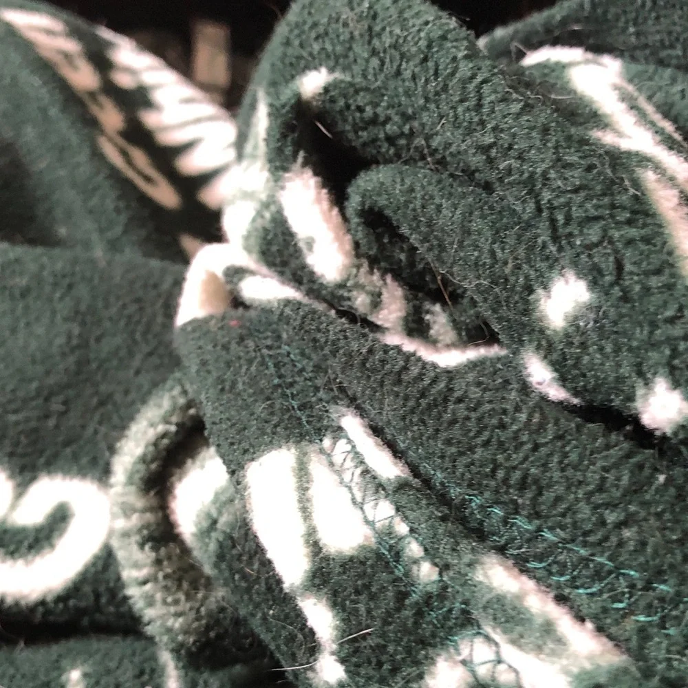Cozy Dark Green Fleece Blanket with White Accent